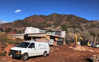 Van in front of Construction site cropped and email Performance Electronics van at Construction site
