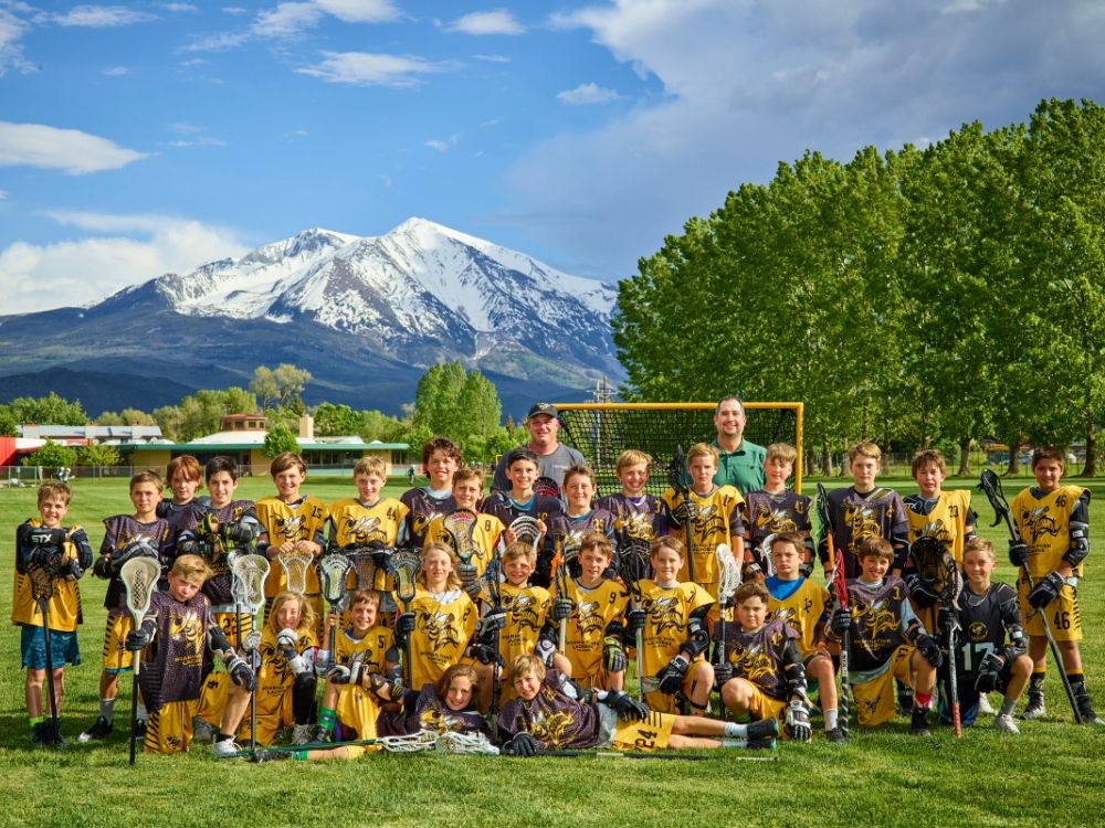 Lacrosse team photo with Mt. Sopris in the background