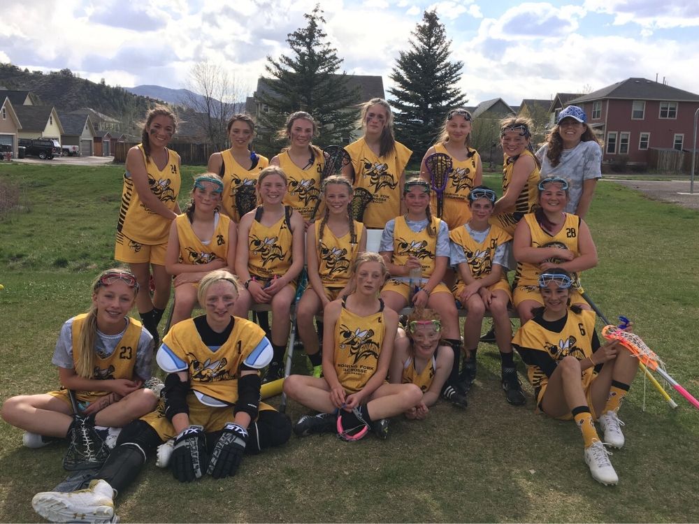 Girls Lacrosse team photo with Mt. Sopris in the background